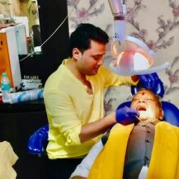 Dr. Rohit Raj treating a patient